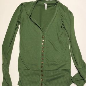 Moss green cardigan with brass color buttons.